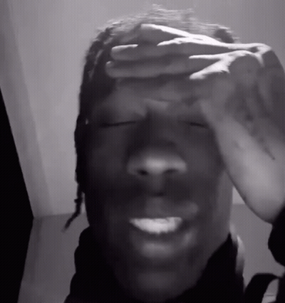 A Man Covering His Face With His Hands And Smiling GIF