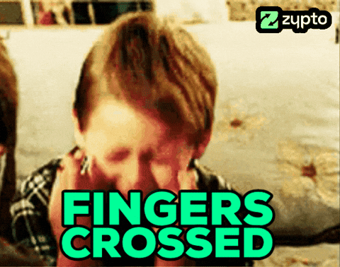 A Man Covering His Face With His Hands And The Words Fingers Crossed GIF