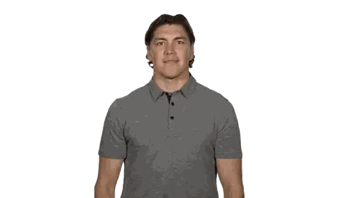 A Man Covering His Mouth With His Hand While Wearing A Grey Shirt Sticker