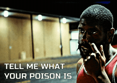 A Man Covering His Nose With His Finger And The Words Tell Me What Your Poison Is GIF
