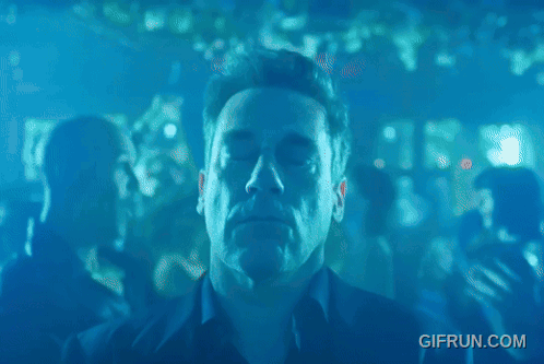 A Man Dancing In A Club With A Gifrun.com Watermark GIF