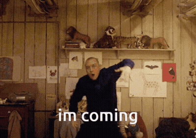 A Man Dancing In A Room With The Words Im Coming GIF