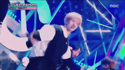 A Man Dancing On A Stage With The Words Break All The Rules Written Above Him GIF
