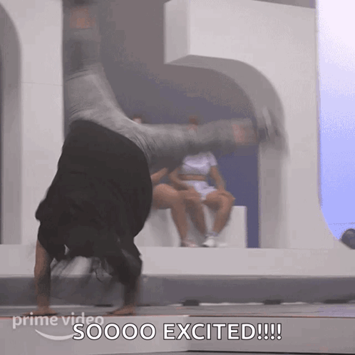 A Man Doing A Handstand With The Words Soooo Excited Written Below Him GIF