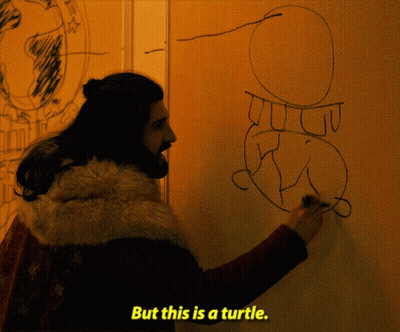 A Man Drawing A Turtle On A Wall With The Words But This Is A Turtle Below Him GIF