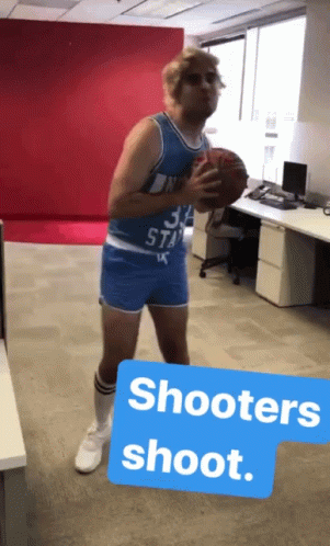 A Man Dressed As A Basketball Player With The Number 34 On His Shirt GIF