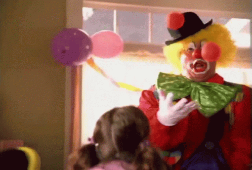 A Man Dressed As A Clown Is Talking To A Little Girl GIF