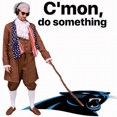 A Man Dressed As Benjamin Franklin Holding A Cane In Front Of A Panthers Logo GIF