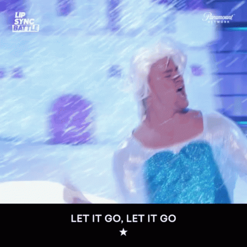 A Man Dressed As Elsa From Frozen Is Dancing In The Snow GIF