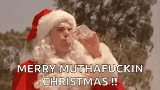 A Man Dressed As Santa Claus Is Drinking From A Bottle And Saying Merry Muthafuckin Christmas . GIF