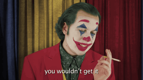 A Man Dressed As The Joker Smoking A Cigarette And Saying You Wouldn 'T Get It GIF