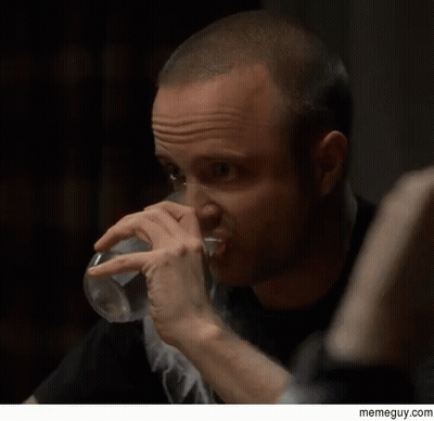A Man Drinking A Glass Of Water With A Memeguy.com Watermark On The Bottom GIF
