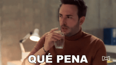 A Man Drinking A Glass Of Water With Que Pena Written On The Bottom Of The Image GIF