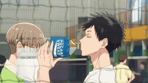 A Man Drinking From A Bottle That Says Pocari Sweat On It GIF
