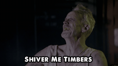 A Man Drinking From A Bottle With The Words " Shiver Me Timbers " Below Him GIF