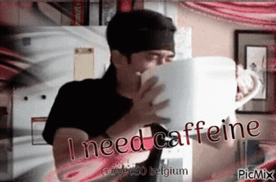 A Man Drinking From A Cup With The Words I Need Caffeine GIF