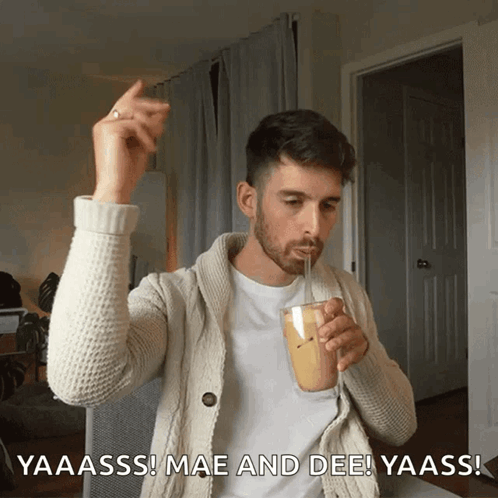 A Man Drinking Through A Straw With The Words Yaaass Mae And Dee In The Corner GIF