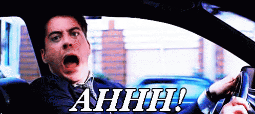 A Man Driving A Car With His Mouth Open And The Words Ahhh Written On The Bottom GIF