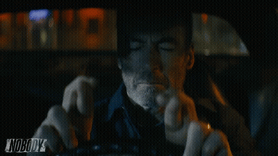 A Man Driving A Car With The Word Nobody On The Bottom GIF