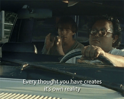 A Man Driving A Car With The Words " Every Thought You Have Creates It 'S Own Reality " Written On The Windshield GIF