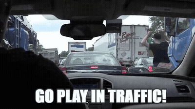 A Man Driving A Car With The Words Go Play In Traffic GIF