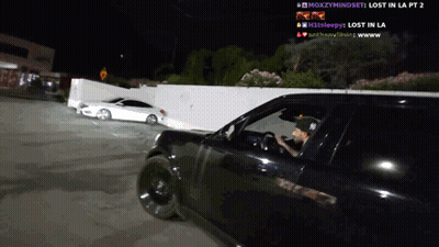 A Man Driving A Car With The Words Lost In La Pt 2 On The Screen GIF