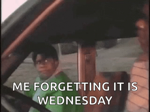 A Man Driving A Car With The Words " Me Forgetting It Is Wednesday " On The Screen GIF
