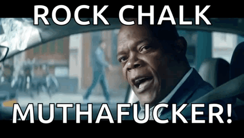 A Man Driving A Car With The Words Rock Chalk Muthafucker GIF