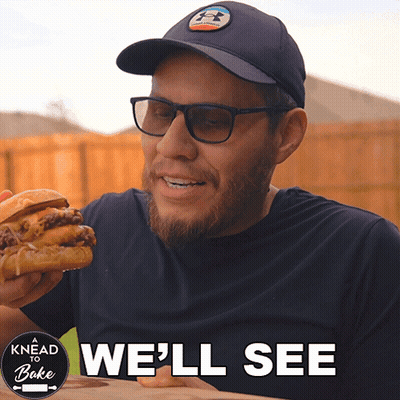 A Man Eating A Hamburger With The Words " We 'Ll See " Above Him GIF