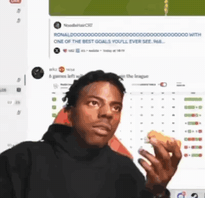 A Man Eating A Sandwich In Front Of A Computer Screen . GIF