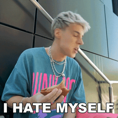 A Man Eating A Sandwich With The Words " I Hate Myself " On The Bottom GIF