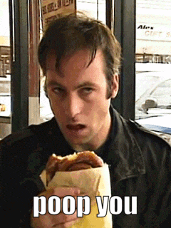 A Man Eating A Sandwich With The Words Poop You Written On It GIF