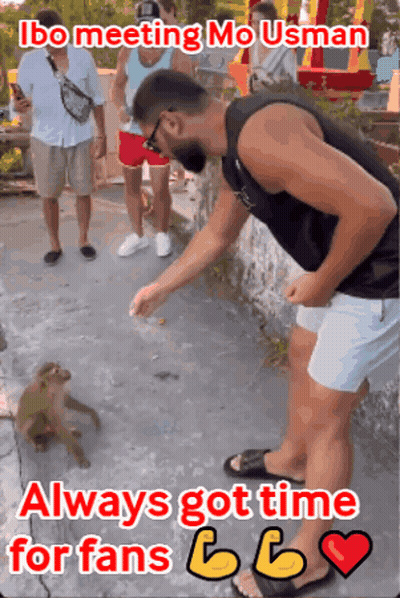A Man Feeding A Monkey With The Caption Ibo Meeting Mo Usman Always Got Time For Fans 666 GIF
