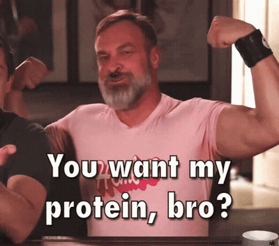 A Man Flexing His Muscles With The Words " You Want My Protein Bro " Below Him GIF