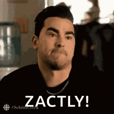 A Man From Schitt 'S Creek Is Making A Face And Says Zachly GIF