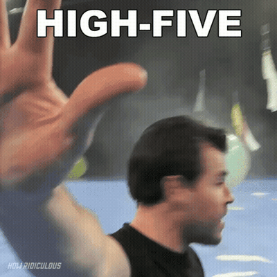 A Man Giving A High Five With His Hand GIF