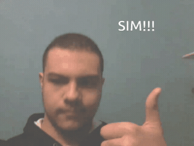 A Man Giving A Thumbs Up In Front Of A Blue Background That Says Sim !!! GIF