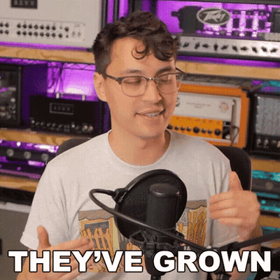 A Man Giving A Thumbs Up In Front Of A Microphone With The Words " They 'Ve Grown " Above Him GIF