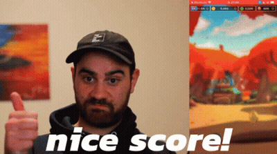 A Man Giving A Thumbs Up In Front Of A Screen That Says Nice Score GIF