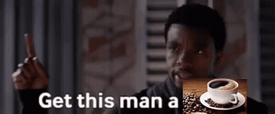 A Man Giving A Thumbs Up Next To A Picture Of A Cup Of Coffee And The Words Get This Man A GIF
