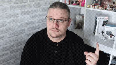 A Man Giving A Thumbs Up Next To A Videomic Box GIF