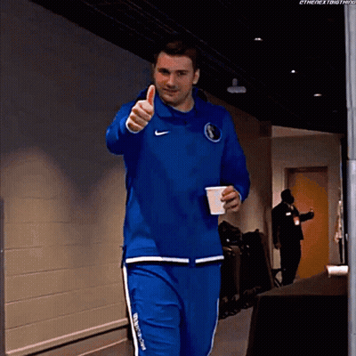 A Man Giving A Thumbs Up While Holding A Cup GIF