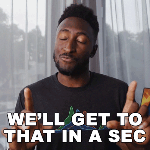 A Man Giving A Thumbs Up With The Words We 'Ll Get To That In A Sec Below Him GIF