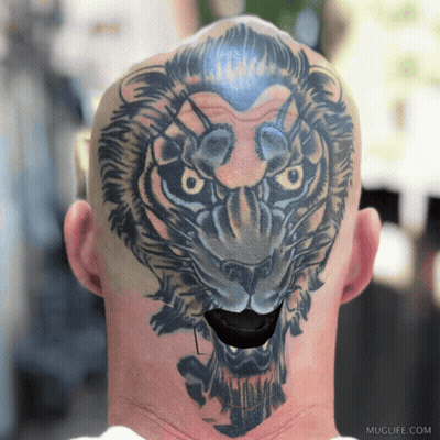 A Man Has A Tattoo Of A Lion On His Head And Neck GIF