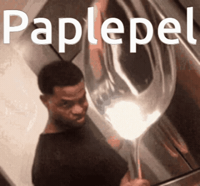 A Man Holding A Balloon With The Word Paplepel Written On It GIF