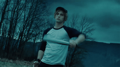 A Man Holding A Baseball Bat In A Field GIF