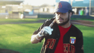 A Man Holding A Baseball Bat With The Letter B On The Hat GIF