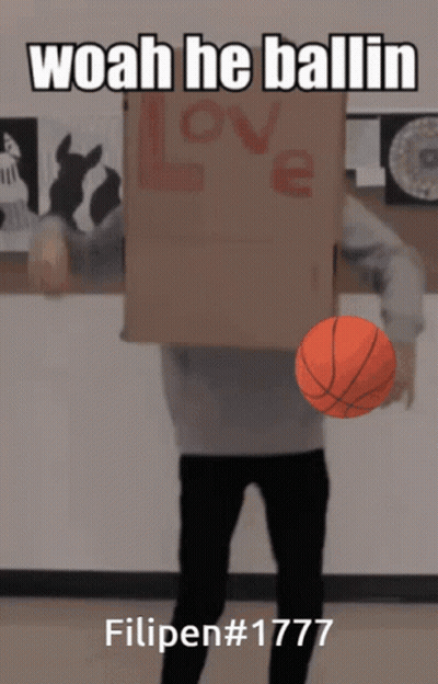 A Man Holding A Basketball In Front Of A Cardboard Box That Says Love GIF