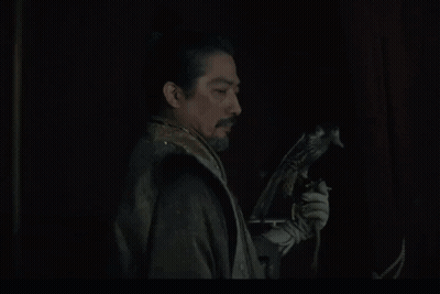 A Man Holding A Bird With The Words " What Is It You Want " Above Him GIF