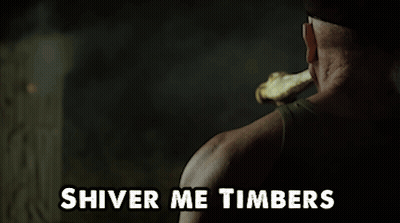 A Man Holding A Bone In His Mouth With The Words Shiver Me Timbers Below Him GIF